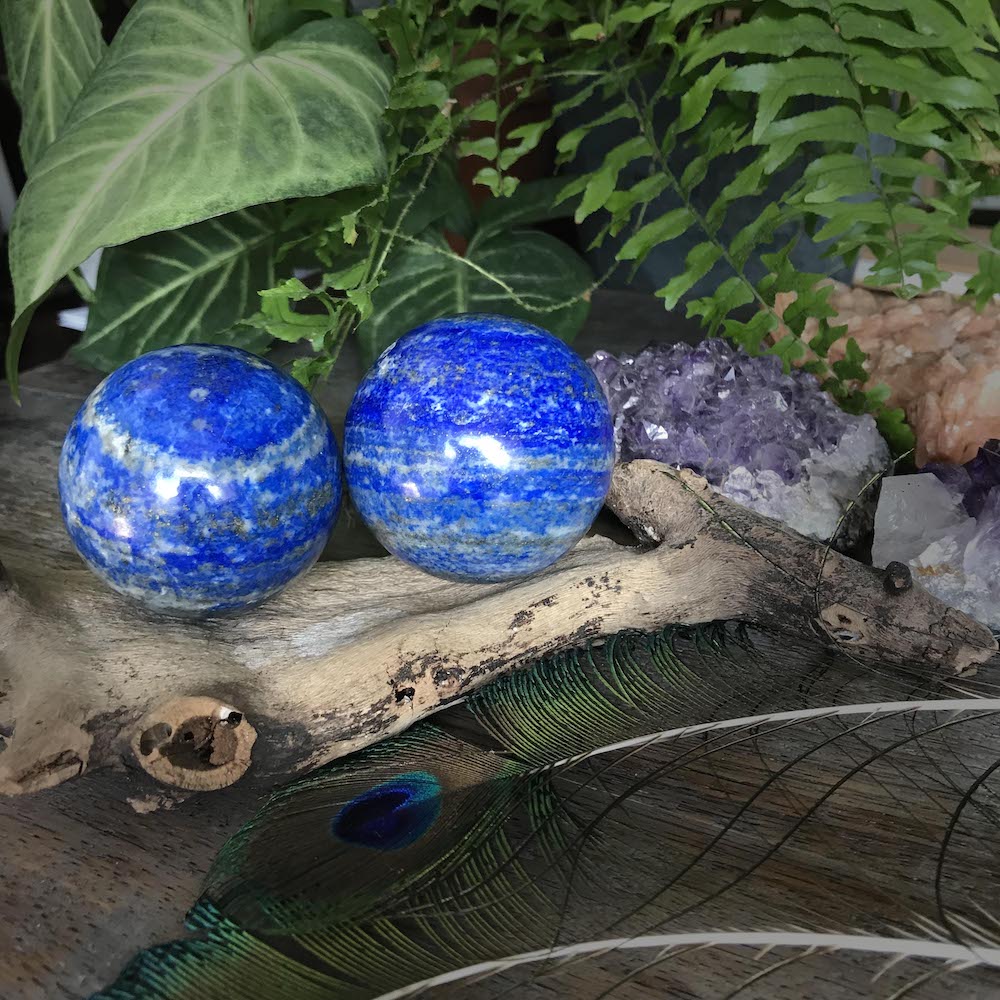 Lapiz Lazuli Crystal Orbs on tree branch with Amethyst